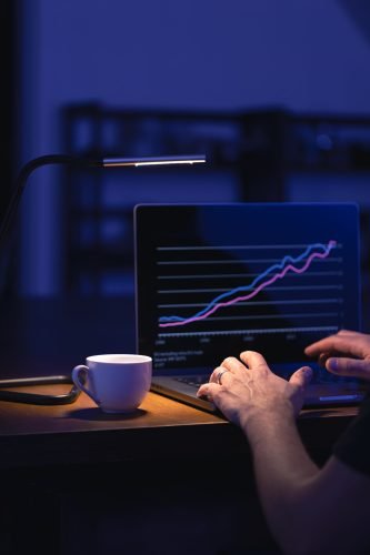 Business man stock exchange trader broker looking at screen. Investor manager analyzing financial chart. Trading online investment data price crypto currency market graph.